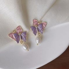 Pearl Pink Purple Flutterby Earrings Are A Dreamy And Enchanting Accessory That Effortlessly Captures The Delicate Beauty Of Butterflies In Flight. Crafted With Meticulous Attention To Detail, These Earrings Combine The Timeless Allure Of Pearls With The Whimsical Charm Of Pink And Light Purple Butterflies. Size: Length: 1 Inch Width: 1 Inch Gold Plated S925. Butterflies In Flight, Earrings Butterfly, Pearl Pink, Delicate Beauty, Purple Butterfly, Accessories Jewelry Earrings, In Flight, Women Accessories Jewelry, Light Purple