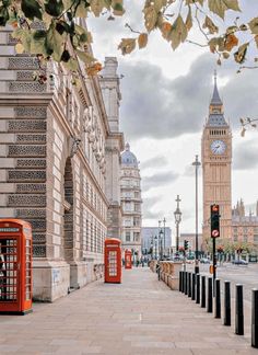 the big ben clock tower towering over the city of london, england as seen from across the street