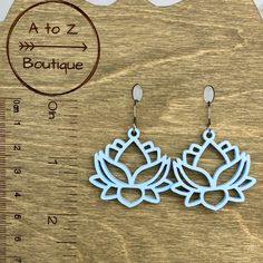 Laser cut light blue lotus flower acrylic earrings surgical steel, hypoallergenic nickel and lead free handmade by me Light Blue Flower Shaped Jewelry Gift, Light Blue Flower-shaped Jewelry For Gifts, Light Blue Hypoallergenic Drop Earrings, Hypoallergenic Flower Shape Earrings, Hypoallergenic Light Blue Drop Earrings, Adjustable Hypoallergenic Flower-shaped Jewelry, Adjustable Light Blue Earrings, Light Blue Drop Earrings Jewelry Gift, Light Blue Drop Earrings For Gift