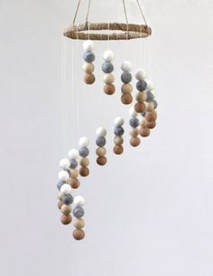 a mobile with balls hanging from it's sides