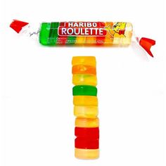 a tube of gummy bears sitting on top of a candy bar next to an arrow