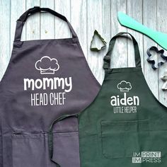 two aprons that say mommy, head chef and little helper