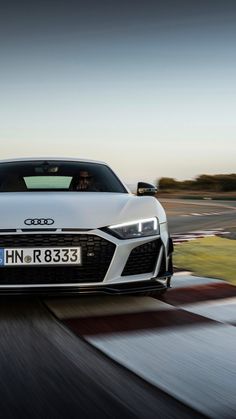 an audi sports car driving on a race track