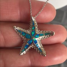 This Beautiful Opal Star Fish 925 Sterling Silver Pendant / Chain Is 6 Grams In Weight. The Chain Is 18” Inches In Length. The Star Fish Is 1” In Length. It’s Stamped 925 Sterling Silver. Please Check All Pictures For Details. Sterling Silver Starfish Charm Pendant Necklace, Sterling Silver Pendant Necklace With Starfish Charm, Elegant Blue Starfish Charm Jewelry, Elegant Blue Jewelry With Starfish Charm, Blue Sterling Silver Necklace With Starfish Charm, Blue Sterling Silver Necklaces With Starfish Charm, Blue Star-shaped Nickel-free Necklace, Elegant Silver Starfish Necklace, Blue Starfish Sterling Silver Necklace