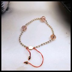 This Beautiful Bracelet Is Made With Faceted Pink, Glass Beads And Paired With Gold And Clear Seed Beads On Blush Tone Threads, And Finished Off With Gold, Metallic End Caps And Adjuster Bead. Made For Small To Medium Wrist - Can Fit Over A Hand Up To 6.5" Or 16cm At Its Widest Point. *Gift Wrap Available By Adding The Gift Wrapping Listing To Your Bundle. Trendy Adjustable Rose Gold Beaded Bracelets, Adjustable Trendy Rose Gold Beaded Bracelets, Adjustable Pink Crystal Bracelet With Round Beads, Pink Adjustable Crystal Bracelet With Round Beads, Adjustable Pink Gold Beaded Bracelets, Adjustable Gold Friendship Bracelet For Party, Adjustable Pink Gold Beaded Bracelet, Gold Friendship Bracelets With Colorful Beads For Parties, Adjustable Round Crystal Bracelet With Faceted Beads