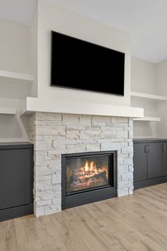 a fireplace with a flat screen tv above it