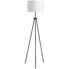 the tripod floor lamp is black and has a white shade on top of it