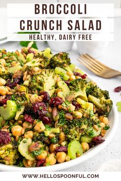 broccoli and cranberry salad in a white bowl with text overlay