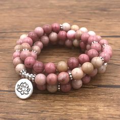 Beautifully hand-crafted, high-quality Mala Beads Bracelet made of 108 Beads of Rhodonite. Hidden safety clasp from zinc alloy. Rhodonite is a stone of compassion, empathy, sensitivity, warmth, and love. It is an emotional balancer that removes emotional traumas and scars from the past and nurtures forward-thinking with love and gratitude. It stimulates, clears and activates the heart and generates flow and energy. Balancing yin-yang, it helps to achieve one's highest potential. Malas have a spe Prayer Bead Bracelet, Mala Beads Bracelet, Mala Bead Necklace, Meditation Bracelet, Fashion Beads, 108 Mala Beads, Yoga Bracelet, 108 Bead, Mala Bracelet