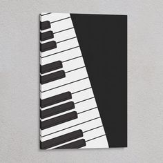 a black and white piano is on the wall