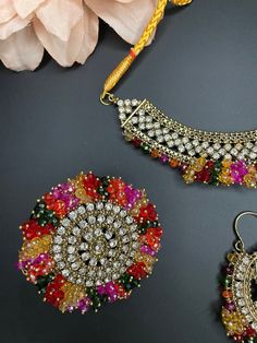 high quality diamond choker/indian multi color set/pakistani choker/jaago haldi sangeet/wedding tikka and earrings This beautiful choker comes with matching earrings, ring and tikka and can be paired separately for a simple look. The colors are multi and is made of cubic zirconia stones for a gorgeous sparkle. Diamond Choker Indian, Beautiful Chokers, Dainty Choker, Indian Necklace, Diamond Choker, Bollywood Jewelry, Choker Set, Authentic Indian, Bridal Jewellery Indian