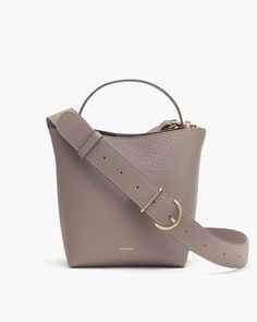 Mini Linea Bucket Bag – Cuyana Chic Everyday Luxury Crossbody Satchel, Modern Everyday Luxury Shoulder Bag With Detachable Strap, Elegant Satchel Bucket Bag, Modern Everyday Luxury Crossbody Shoulder Bag, Modern Bucket Bag With Gold-tone Hardware For Everyday Luxury, Elegant Bucket Bag With Detachable Strap For On-the-go, Elegant On-the-go Bucket Bag With Detachable Strap, Modern Crossbody Bags For Everyday Luxury, Elegant Top Handle Bucket Bag For On-the-go