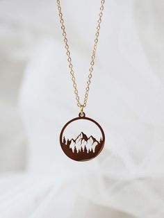 14K gold thick layered over High Quality Solid Stainless Steel. can be worn in water.  Our jewelry is made to last, anti-tarnish, higher durability than a regular gold-plated brass material, perfect for everyday wear. * Finish: 14K Gold * Natural/Mountain view forest princess necklace * Featuring Adjustable Chain 16.5 inches to 18.5 inches. * All items are nicely packaged ready to gift in elegant jewelry boxes We meet your demands with expert craftsmanship. Our biggest goal is to serve you in top quality. Mostly our products are open for personalization, feel free to ask for any kind of customization for the product you are interested in. We will gladly try to make it happen. Nature-inspired Personalized Jewelry For Everyday, Nature-inspired Personalized Everyday Jewelry, Nature-inspired Hypoallergenic Jewelry For Gifts, Unique Rose Gold Round Pendant Jewelry, Unique Circular Jewelry Gift, Unique Circular Jewelry For Gift, Everyday Gold Nature-inspired Jewelry, Nature-inspired Round Necklaces For Jewelry Making, Bohemian Circle Jewelry For Gifts