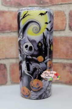 a halloween themed glass with pumpkins and jack - o'- lanterns on it