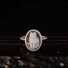 Chic and classy. Not only for cat lovers! This delicate, vintage inspired ring is an everyday wear piece.  A genuine (shell) cameo featuring a lovely cat is set in a simple .925 bezel and soldered on a beaded wire band. Made by hand in our jewellery studio in Greece. Each cameo is hand carved and each ring is made after purchase with respect to individuality and uniqueness. Please choose your favorite stone from the drop down menu during checkout. See last photo of the listing for details. -DETA Carved Stone Ring, Cat Rings, Jewellery Studio, Vintage Inspired Rings, Lovely Cat, Sterling Silver Cat, Cameo Jewelry, Cat Ring, Cameo Ring