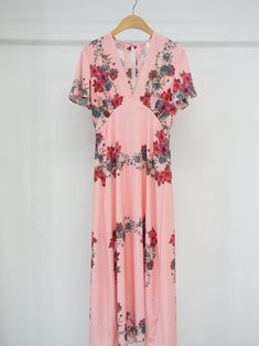 Maxi length V neck dress with short sleeve and pink floral print. Silky satin like material feel. Model is in MINUSEY S. * MINUSEY S = EU 34, US 2* MINUSEY M = EU 36, US 4* 100% Polyester* Dry clean* Made in Korea - Model Height: 170cm/5'7" (US2, EU34) Pink Floral Print V-neck Maxi Dress, Pink Floral V-neck Dress For Brunch, Pink V-neck Rose Print Dress, Pink Floral Print Knee-length Dress, Pink V-neck Maxi Dress With Rose Print, Elegant Pink V-neck Floral Dress, Feminine Floral Print Midi Dress With Short Sleeves, Pink Floral Short Sleeve Dress For Summer, Pink Rose Print Short Sleeve Dress