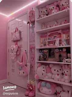 a room with pink walls and shelves filled with stuffed animals