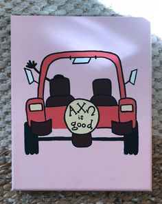 a pink canvas with an image of a red car