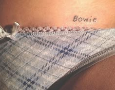 a woman's stomach with the word bowtie written on it