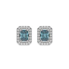 Fancy Blue Classic Radiant Diamond Halo Earrings made with a fancy Blue radiant cut solitaire diamonds set in a four prong setting and surrounded by a halo of round brilliant-cut diamonds in prong setting.Details: - Made to Order- Focal Diamond Weight: 2.00 CT, 3.00 CT, 4.00 CT, 5.00 CT, 6.00 CT- Accent Diamond Weight: 0.55 CT - 1.35 CT (Carat weight varies based on chosen Focal Diamond)- Focal Diamond Cut: Radiant- Accent Diamond Cut: Round- Diamond Type: Lab Grown Diamond (CVD, HPHT)- Diamond Luxury Blue Diamond Earrings With Prong Setting, Blue Diamond Earrings With Diamond Accents, Blue Cubic Zirconia Diamond Earrings With Prong Setting, Blue Diamond Earrings With Accents, Elegant Blue Gia Certified Diamond Earrings, Blue Diamond Earrings With Diamond Cut, Elegant Blue Diamond-cut Earrings, Blue Diamond Cut Earrings, Blue Emerald Cut Earrings For Formal Occasions