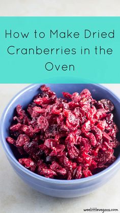 cranberries in a blue bowl with the title how to make dried cranberries in the oven