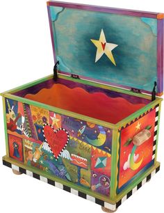 a brightly painted chest with a star on the top and writing all over it's sides