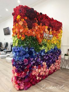 a large rainbow colored flower wall in an office