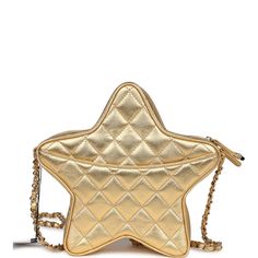 This Chanel star bag is in metallic gold lambskin leather with gold tone hardware and features a half moon back pocket, zip top closure and an interwoven gold tone chain link and gold leather shoulder strap.The interior is lined in gold leather and canvas with two open slip pockets on each wall.Collection: 24C (RFID)Origin: ItalyCondition: New and never wornAccompanied by: Chanel box, Chanel dustbag, carebook, RFID and retail UPCMeasurements: 8.5" width x 7.25" height x 2" depth; 19" strap drop Gold Leather Shoulder Bag With Gold-tone Logo Plaque, Luxury Gold Bag With Zipper Closure, Designer Gold Shoulder Bag With Zipper Closure, Designer Gold Shoulder Bag With Zipper, Gold Crossbody Bag With Gold-tone Logo Plaque, Star Bag, Chanel Box, Leather And Canvas, Birkin 25