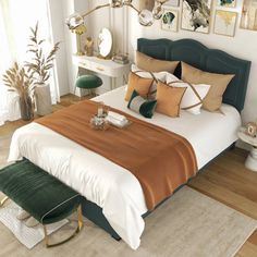 a large bed sitting in a bedroom on top of a hard wood floor