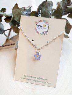 Beautiful tiny blue forget me not necklace.  Real pressed forget me not set in resin. This tiny necklace is perfect for everyday wear. Carry a tiny forget me not with you and remember a loved one. This is available on a 18 inch silver plated chain, 18 inch gold plated chain or an 18 inch sterling silver chain Matching earrings are available  https://www.etsy.com/uk/listing/982646519/forget-me-not-sterling-silver-pressed?ref=shop_home_active_25&frs=1&crt=1 Due to this product being handmade by myself slight variations will occur. These flowers will vary between 5mm and 10mm. Please remove before showering and bed. Forget Me Not Flower Necklace, Blue Sterling Silver Necklace With Flower Charm, Tiny Blue Sterling Silver Jewelry, Blue Sterling Silver Birth Flower Jewelry, Blue Sterling Silver Jewelry With Birth Flower, Dainty Blue Jewelry With Pressed Flowers, Dainty Blue Birth Flower Jewelry, Forget Me Not Necklace, Lavender Necklace