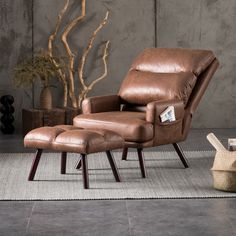 a brown leather recliner chair and ottoman in front of a wall with a plant