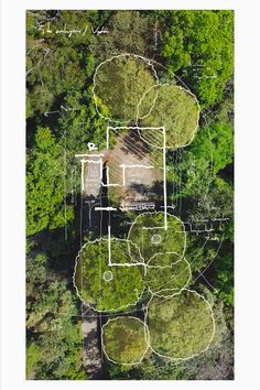 an aerial view of a house surrounded by trees