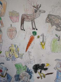 children's drawing of animals and vegetables on paper