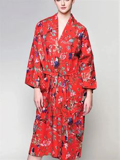 This luxurious long Red Kimono Robe features a gorgeous birds of paradise print on soft lightweight cotton. Handmade by artisans in Rajasthan, India, this truly exclusive red kimono robe features a front tie belt, long flowy sleeves and two large front pockets. Handcrafted with eco-friendly dyes, Fair trade and sustainably made, it's the perfect addition to your lounge-wear wardrobe. The lightweight woven 100% Cotton fabric also makes this a unique kimono bathrobe. This red kimono robe from Sevy Red Robe With Kimono Sleeves For Spring, Red Spring Robe For Loungewear, Red Spring Vacation Robe, Red Cotton Kimono For Vacation, Red Cotton Long Sleeve Robe, Red Cotton Robe For Spring, Red Beach Robe For Spring, Red Long Sleeve Cotton Robe, Long Sleeve Red Cotton Robe