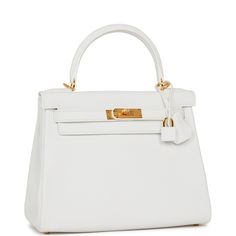 This is a payment 1 of 2 for PH--total of the bag is $27500 This Kelly, in the Retourne style, is in White clemence leather with gold hardware and has tonal stitching,front flap, two straps with center toggle closure, clochette with lock and two keys, single rolled handle and removable shoulder strap. The interior is lined in white chevre and has one zip pocket with Hermes engraved pull and two open pockets on the opposite side.Collection: YOrigin: FranceCondition: Pristine; new or never (plasti White Hermes Kelly, Hermes Kelly Retourne, Hermes Box, Bag Collection, Dior Shoes, Handbag Backpack, Newport, Tote Handbags, Gold Hardware