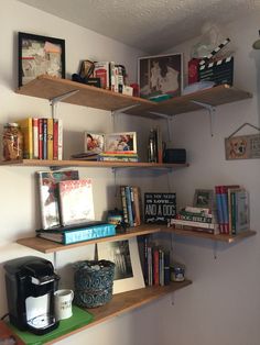 some shelves with books and pictures on them