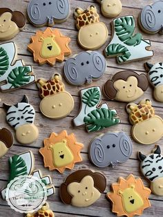 many decorated cookies with different animals on them