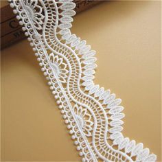 a white lace on a beige background