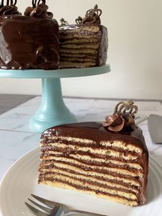 a piece of cake on a plate with a fork next to it and a knife