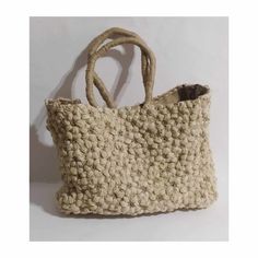 Handmade, tote bag, made with with two coloured natural jute and burlap inside.It is hand crocheted,in a puff flower pattern, it has a magnetic clasp closure and an inner pocket, with zipper. A unique beach bag,quite big,that you can use as a shopping bag as well, through spring and summer. A very stylish and eco-friendly gift for youself or someone you love, a bag that you will have for many,many years. Weight:1350 gr Dimentions: 40*30*12cm Eco-friendly Woven Cream Beach Bag, Eco-friendly Cream Woven Beach Bag, Eco-friendly Beige Crochet Bucket Bag, Eco-friendly Cream Rectangular Beach Bag, Cream Jute Beach Bag For Daily Use, Cream Woven Jute Beach Bag, Eco-friendly Sand Shoulder Bag For Daily Use, Eco-friendly Cream Beach Bag, Cream Jute Beach Bag With Braided Handles