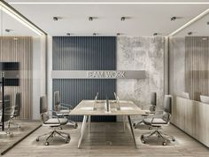 an empty conference room with chairs and desks in front of a wall that reads team work