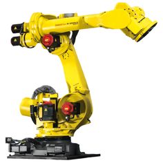 a yellow robot is sitting on top of a black stand and has its arm extended