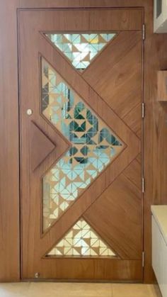 a wooden door with glass inserts on it