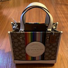 Coach Cj576 Dempsey Tote Bag 22 Signature Jacquard Rainbow Stripe & Coach Coach Multicolor Double Handle Bags, Coach Dempsey Tote, Coach Dempsey Tote 22, Coach Signature Multicolor Crossbody, Multicolor Coach Bag With Zipper Closure, Multicolor Coach Shoulder Bag For On-the-go, Coach Multicolor Bags With Gold-tone Hardware, Bags Coach, Rainbow Stripes