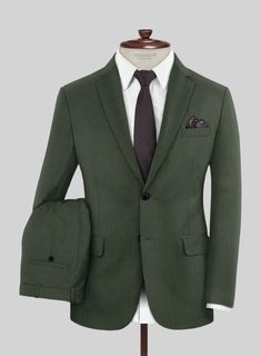 The best way to predict the future is to create it in the way you like. Our custom-made Napolean Military Green Wool Suit will take you to the way of freedom. Crafted from wool blend, the fabric has a subtle unique texture that is rare to find and has a very professional and friendly vibe to itself. Our suit will be perfect for meetings, travel and is designed to keep you warm in winters and cool in summers. Each time you are going to wear our suit, you will turn up as a fine gentleman.  Look Includes   Napolean Military Green Wool Fabric  Two Button Jacket Style  Notch Lapel  Horn Royal Black Buttons  Single Vent  Three Cuff Buttons  Two Welted Back Pockets on Trousers    Click 'Customize Now' to modify the look if needed.   Lining: Viscose; Dry Clean. Luxury Green Single-breasted Suit, Luxury Green Wool Suits, Luxury Green Wool Sport Coat, Green Wool Suit, Grey Tweed Suit, Herringbone Tweed Jacket, White Linen Suit, Green Velvet Jacket, Peaky Blinders Suit