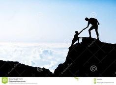 two people helping each other up the side of a mountain stock photo - image 349782