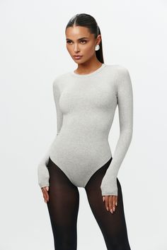 Fitted Bodysuit With Thumbholes And Scoop Neck, Fitted Scoop Neck Bodysuit With Thumbholes, Fall Bodysuit With Thumbholes And Minimal Stretch, Fitted Crew Neck Bodysuit For Spring, Sleek Stretch Bodysuit For Loungewear, Fitted Scoop Neck Bodysuit For Fall, Basic Bodysuit For Loungewear, Basic Long Sleeve Bodysuit For Spring, Basic Loungewear Bodysuit