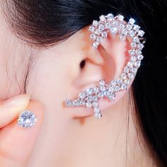 Material: Copper, Silver Plated, Cubic ZirconiaSize: 5.4cm, 0.8cmWeight: 10g per pairDesign: Asymmetrical Crystal Ear Cuff and Round Stud Statement EarringsColor: White, Silver Luxury Cubic Zirconia Ear Cuff For Wedding, Party Cubic Zirconia Ear Cuff, Cubic Zirconia Round Ear Cuff, Elegant Cubic Zirconia Dangle Ear Cuff, White Cubic Zirconia Ear Cuff, Long Ear Cuff, Ear Wrap Earrings, Crystal Ear Cuff, Trendy Fashion Accessories