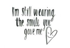 i'm still wearing the smile you gave me love quote on white paper with black ink