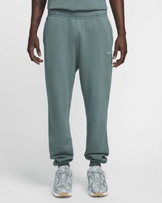 These premium sweatpants feature a new exclusive fleece that's soft and structured. Pants include ribbed ankle cuffs, reflective piping and zippered pockets. Shown: Mineral Slate/Faded Spruce/Mica Green Style: FN7661-382 Structured Pants, Green Style, Ankle Cuffs, Green Fashion, Piping, Sweatpants, Zipper, Nike, Pants